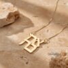 Close-up of 14K Gold Ahava Necklace in Hebrew, featuring the word "Ahava" (Love), handcrafted in solid yellow