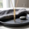 24K gold plated Hebrew bar necklace styled as a Judaica gift