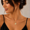 Woman with dark hair wearing the two-tone Shema Yisrael Star of David necklace