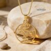 Yellow gold Am Yisrael Chai openwork disc pendant on Jerusalem stone