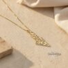 Yellow gold Israel map necklace with soft linen backdrop