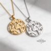 Two-tone comparison of yellow and white gold Shema Israel pendants on marble