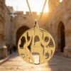 14K gold Shema Israel necklace photographed in the Old City of Jerusalem