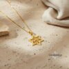14K gold Star of David necklace with soft linen backdrop