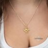 Woman wearing the gold plated Am Yisrael Chai Hebrew necklace