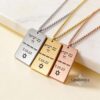 Three engraved dog tag necklaces in silver, gold and rose gold