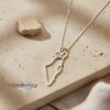 Israel map necklace with Star of David charm on travertine
