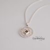 Radiating cut-out pattern of the silver Shema Yisrael circle pendant