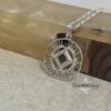 Sterling silver Shema Yisrael circle necklace draped over stone