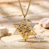 Two-tone gold Shema star pendant on Jerusalem stone