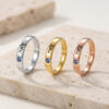 Silver, gold and rose gold Hebrew name rings with birthstones on Jerusalem stone