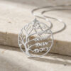 Close up of sterling silver family tree necklace with Hebrew names