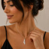 925 sterling silver engraved Israel map necklace with cut-out heart worn by a woman, side view