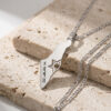Close-up of a sterling silver Israel map pendant with cut-out Star of David and עם ישראל חי engraving on stone