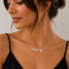 Woman wearing a dainty sterling silver Hebrew name necklace
