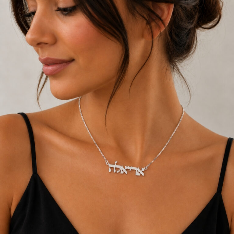 Woman wearing a dainty sterling silver Hebrew name necklace