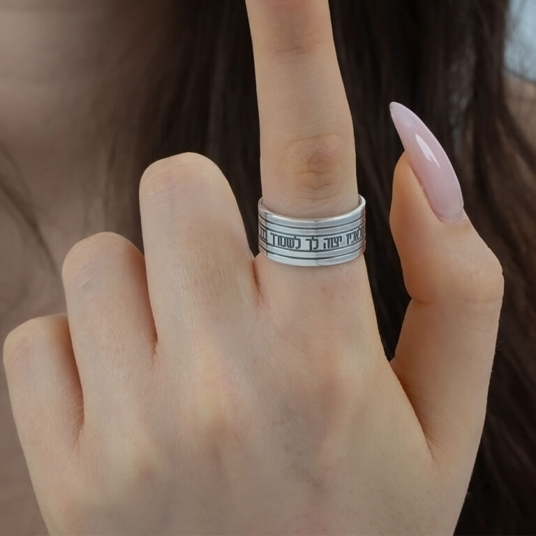 Woman wearing a sterling silver Hebrew verse ring on her finger