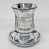 Crystal kiddush cup with silver finish and matching saucer on a light gray background