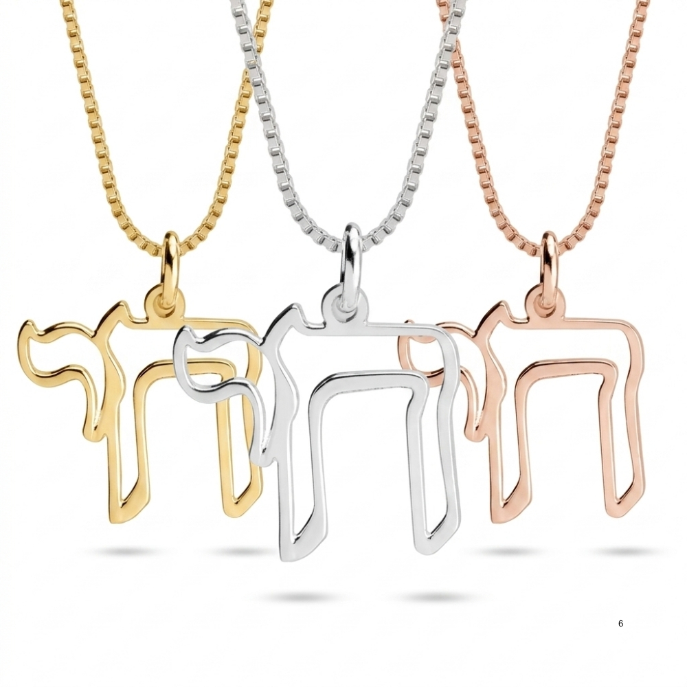 Gold, silver and rose gold open outline Hebrew Chai necklaces side by side on a white background