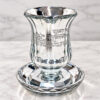 Crystal kiddush cup with saucer on a marble table, silver finish Shabbat goblet