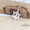 Star of David Necklace with Israel Map Cut-Out — Magen David pendant styled on a wooden block
