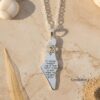Israel Map Necklace with Hebrew Bible Verse — Hebrew verse pendant photographed on sand-toned stone