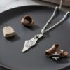 Israel Map Necklace with Hebrew Bible Verse — silver pendant on a dark plate with stone accents