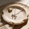 Hebrew Chai Necklace with Israel Map — silver Chai necklace on a ceramic dish