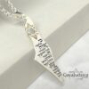 Israel Map Necklace with Engraved Bible Verse — engraved pendant on a pale gray surface