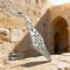 Israel Map Necklace with Engraved Bible Verse — silver pendant photographed in a stone archway