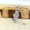 Am Yisrael Chai Israel Map Necklace — silver map pendant on a wooden ledge