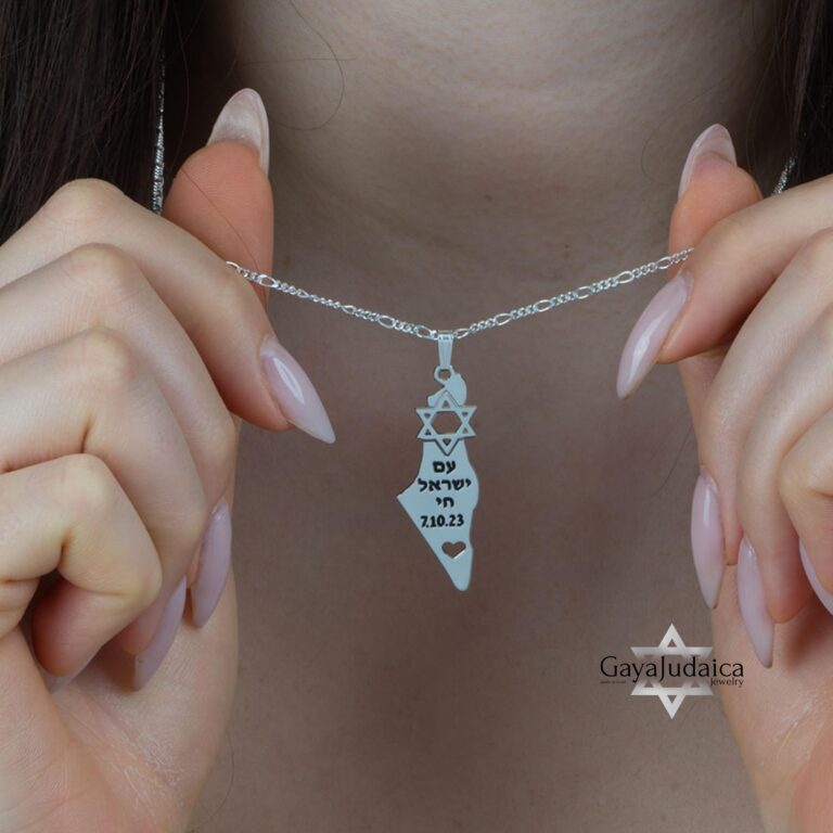 Am Yisrael Chai Israel Map Necklace — pendant held between the fingers for scale