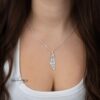 Am Yisrael Chai Israel Map Necklace — model wearing the Am Yisrael Chai map necklace