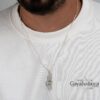 Am Yisrael Chai Israel Map Necklace — necklace worn over a white t-shirt