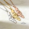 Shema Yisrael Israel Map Necklace — three finishes displayed together on marble