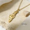Shema Yisrael Israel Map Necklace — gold plated pendant with a sunlit stone backdrop