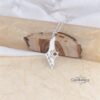 Israel Map Necklace with Cut-Out Star of David — silver pendant photographed against olive wood