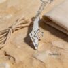 Israel Map Necklace with Cut-Out Star of David — silver map necklace styled with linen