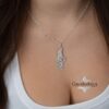 Israel Map Necklace with Cut-Out Star of David — Israel map necklace worn with a white tank top