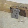 Sterling silver Am Yisrael Chai dog tag on textured paper