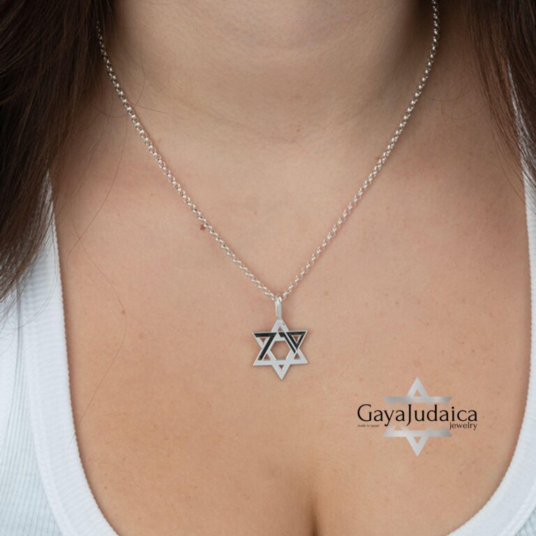 Woman wearing the October 7 memorial Star of David pendant in sterling silver on a fine chain