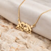 Solid gold Hebrew name necklace for Mom resting on stone and soft linen
