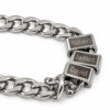 Close-up of three engraved stainless steel name beads on a silver Cuban chain, personalized family necklace for dad