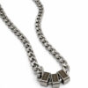 Silver Cuban chain necklace with three engraved name beads seen from an angle on a white background, dad name necklace
