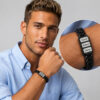 Man in a blue shirt wearing the black Hebrew name bracelet for dad, with a close-up of the engraved name beads